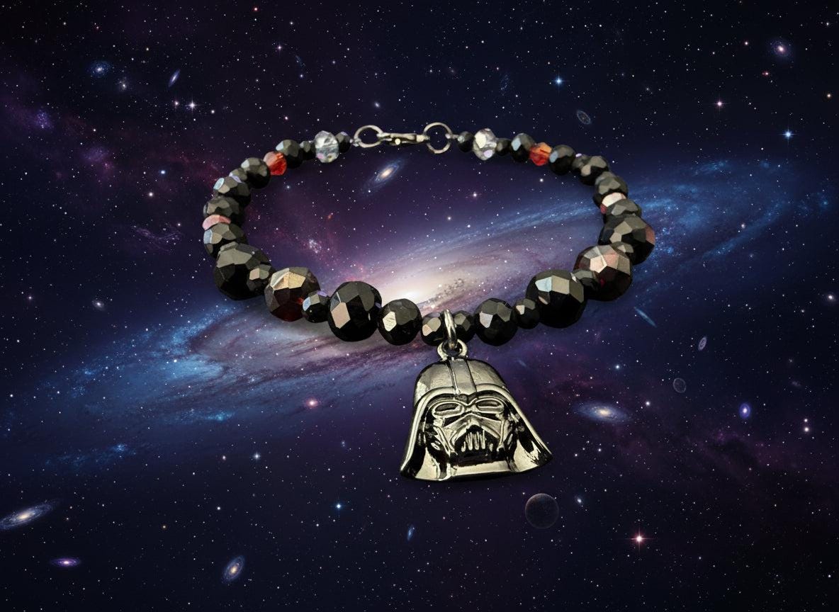 Bracelet with black beads and Darth Vader pendant on a dark textured background