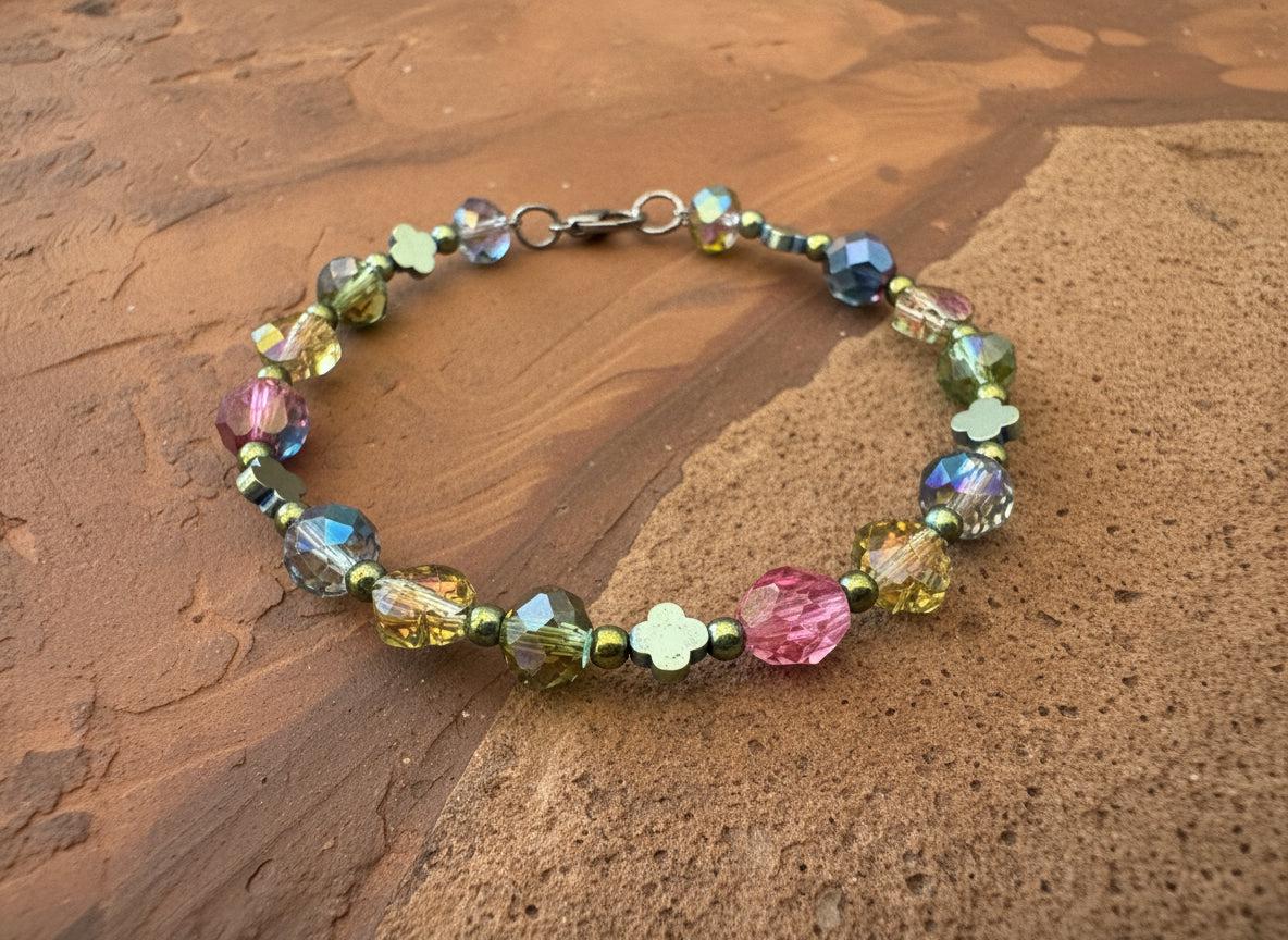 Multicolored beaded bracelet on a dark textured surface
