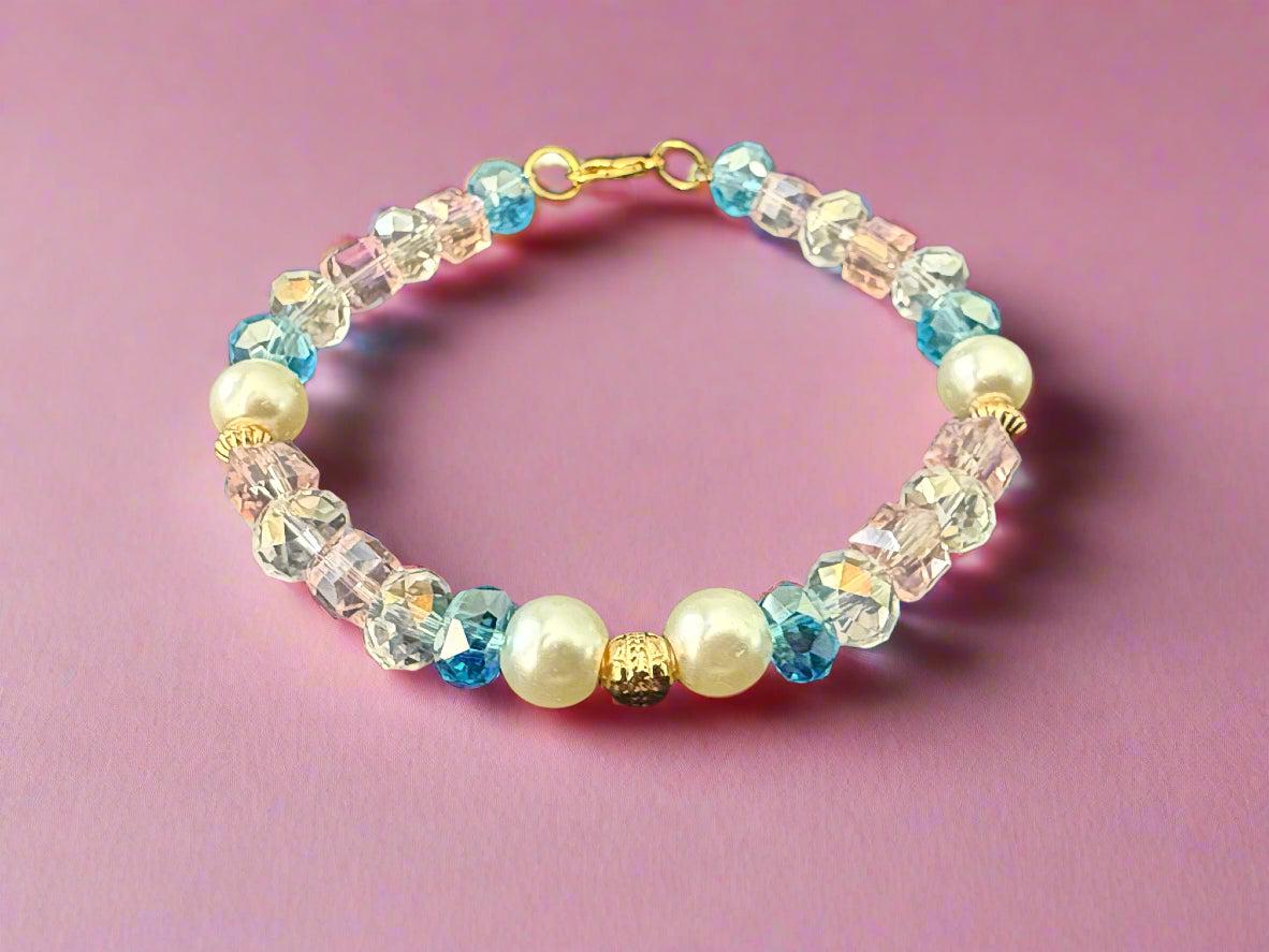 Beaded bracelet with pearls and crystals on a dark background