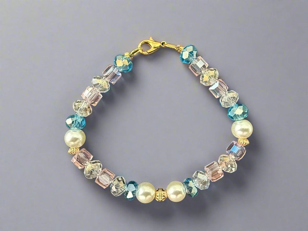 Beaded bracelet with pearls and crystals on a black background