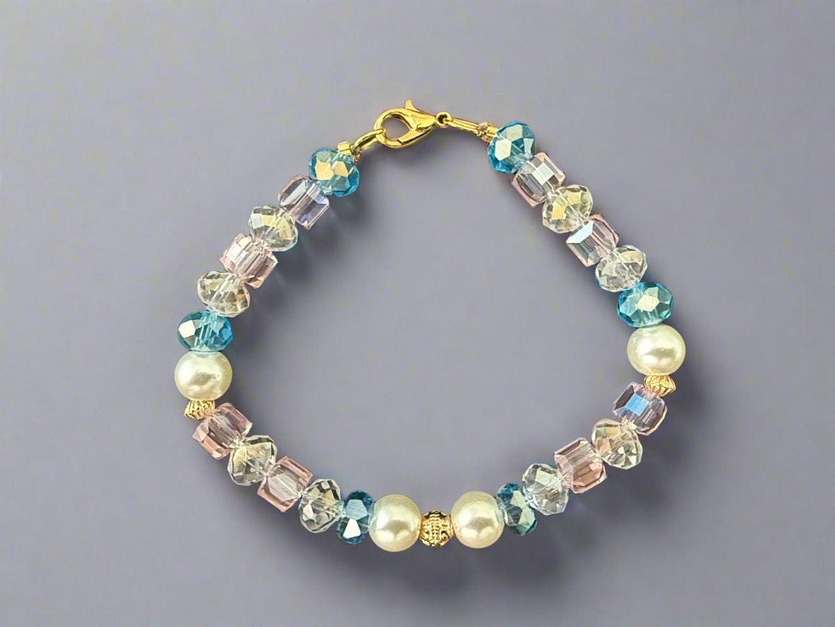 Beaded bracelet with pearls and crystals on a black background