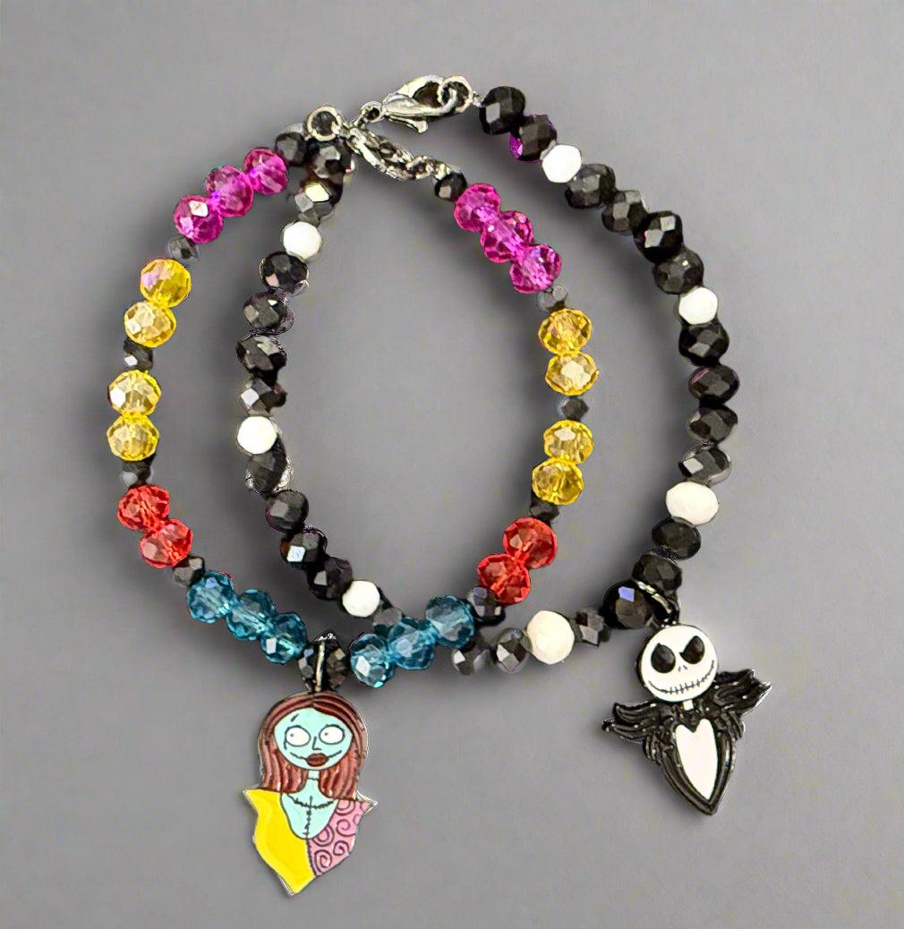 Multicolored beaded bracelet with character charms on a dark background