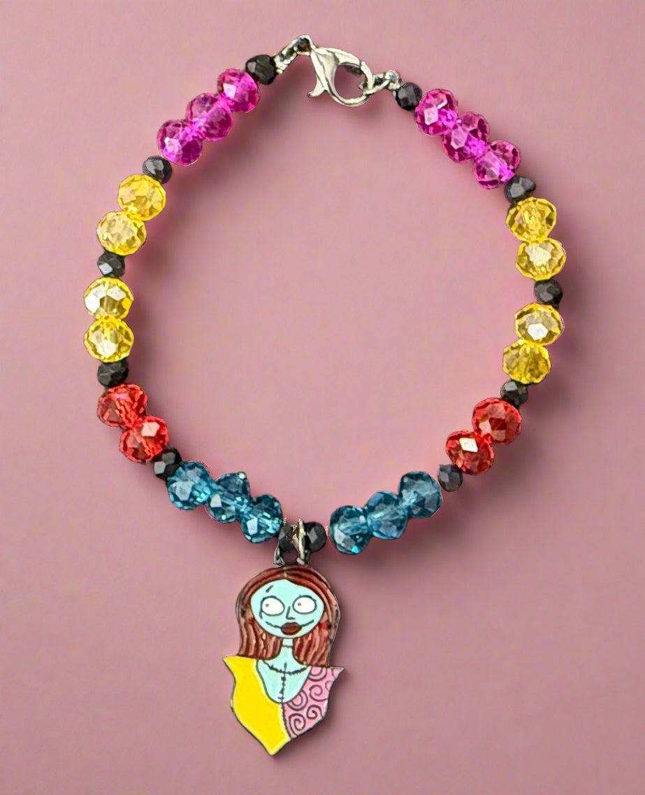 Colorful beaded bracelet with a pendant on a dark background