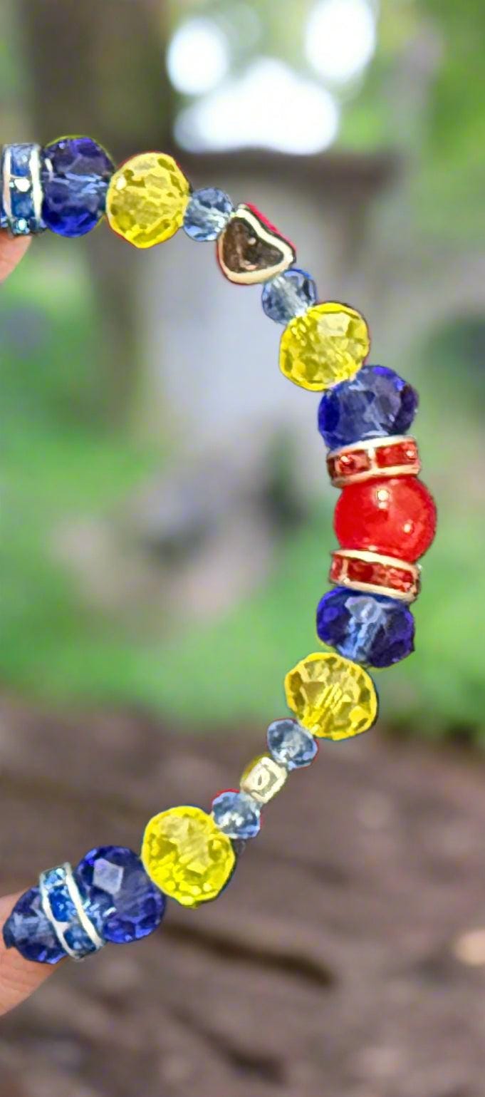 Multicolored beaded bracelet on a dark textured surface