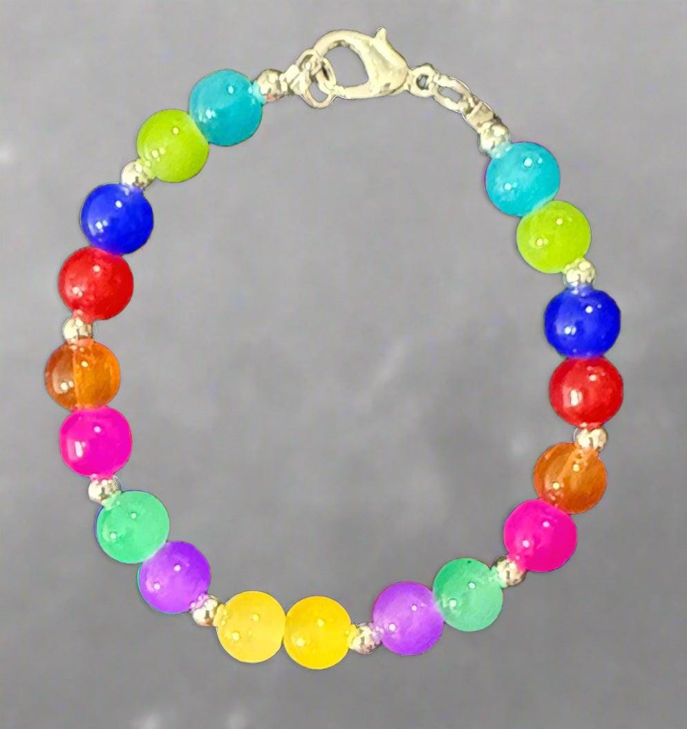 Colorful beaded bracelet with a silver clasp on a black background