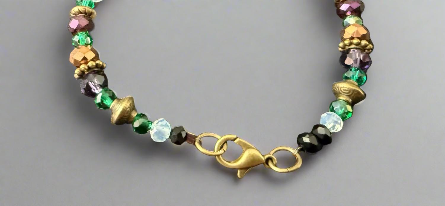 Multicolored beaded bracelet on a dark textured surface