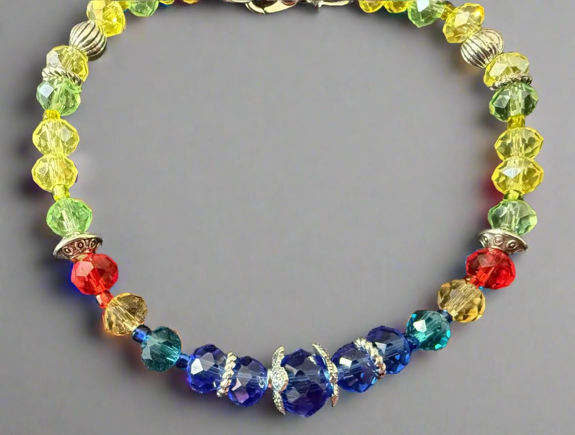 Colorful beaded bracelet on a black textured background