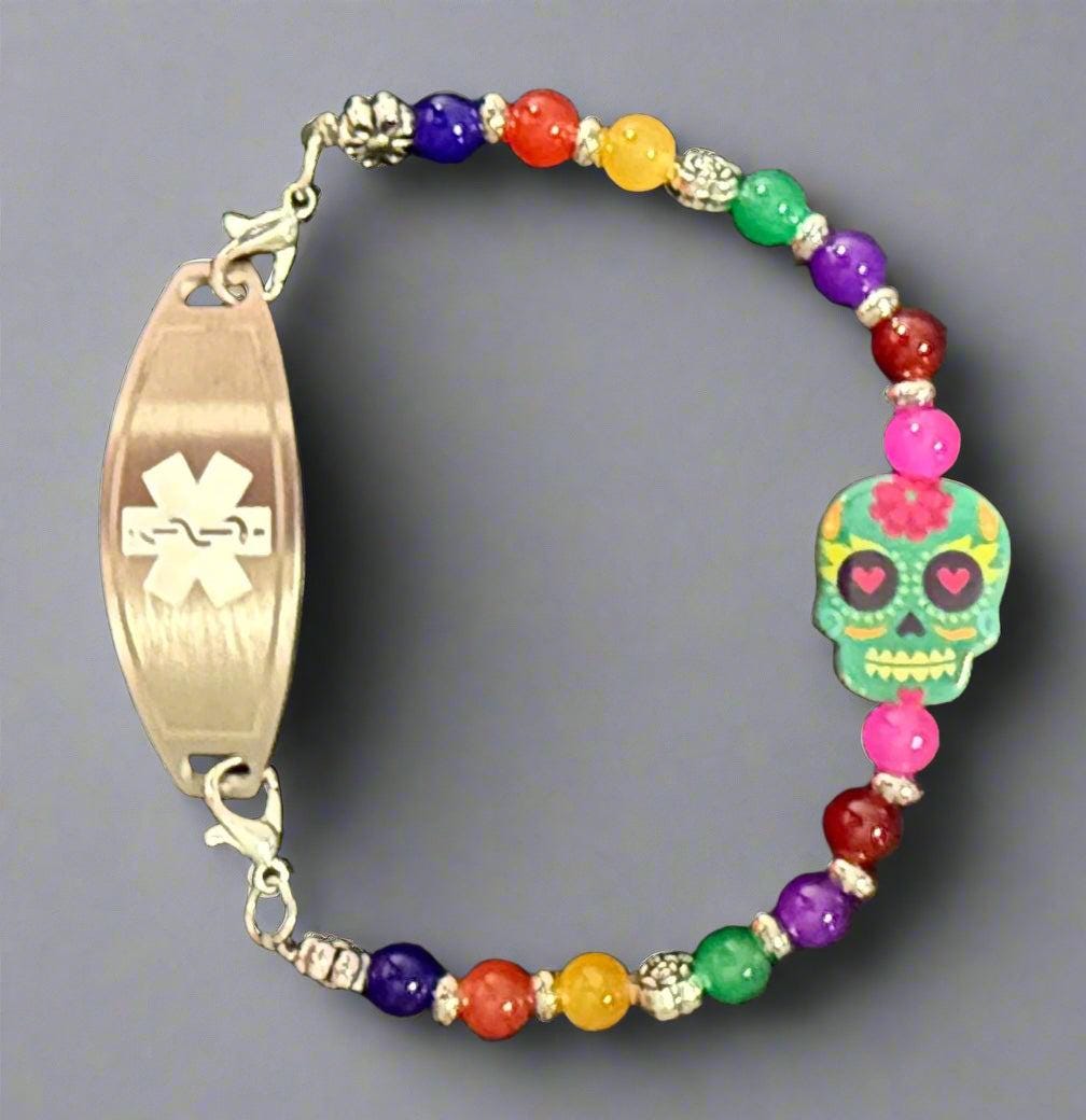 Colorful beaded bracelet with a colorful skull charm on a dark background